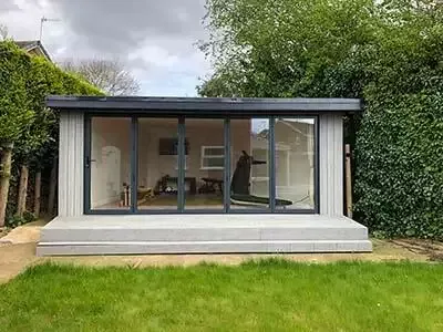 corner garden with bespoke home gym garden room