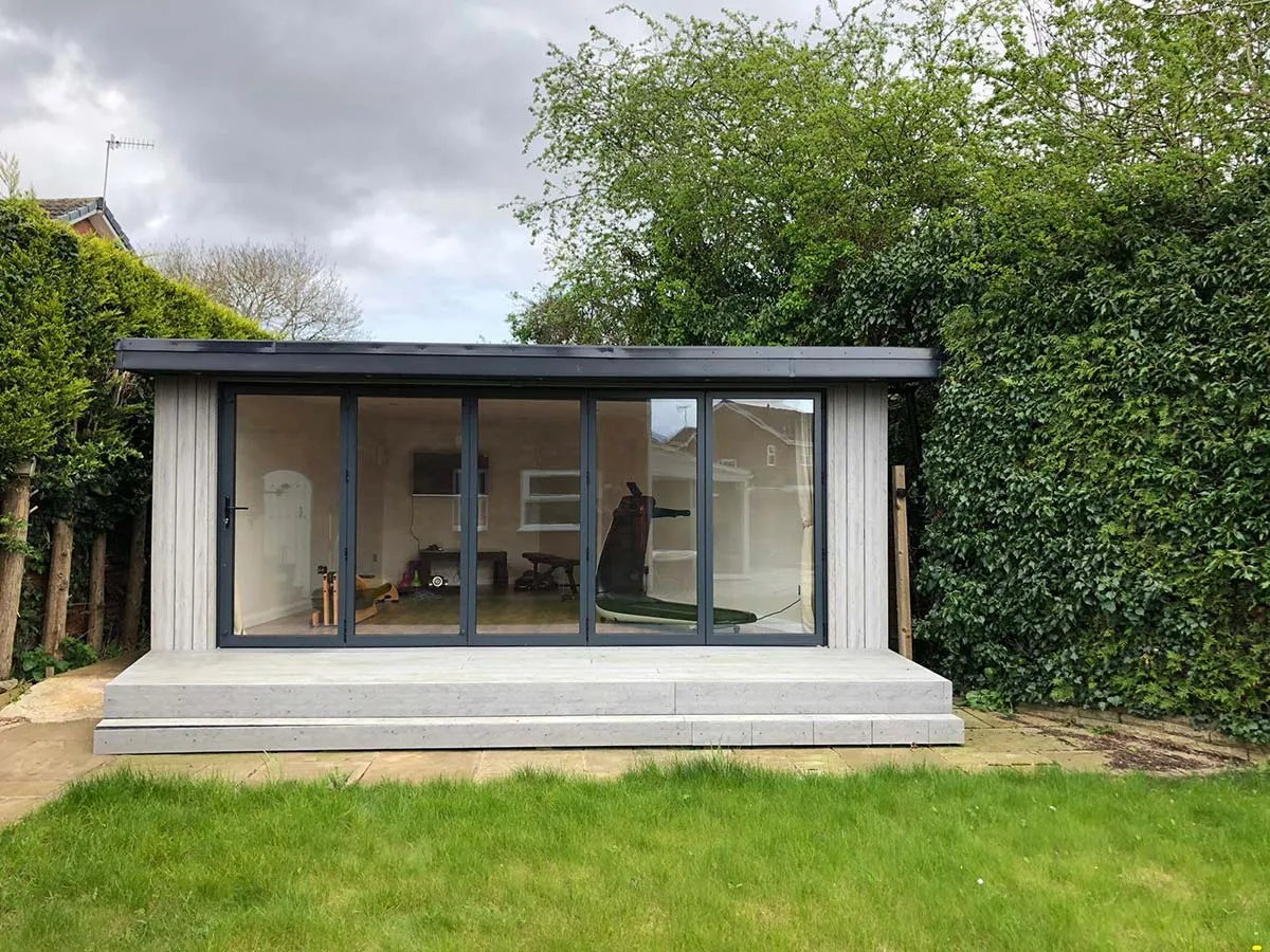 corner garden with bespoke home gym garden room